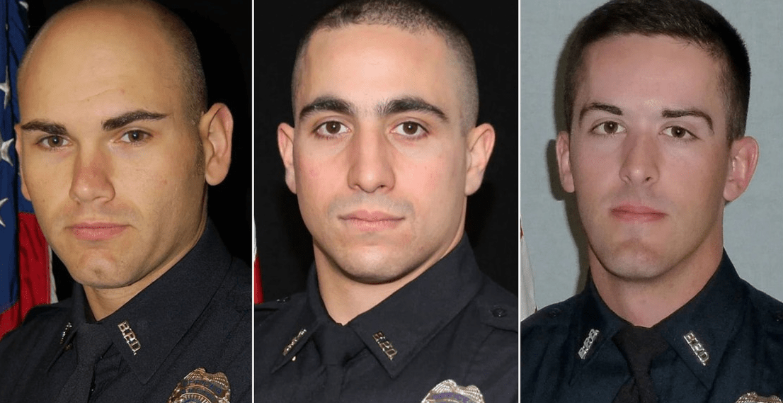 Two Police Officers And A Rescuer